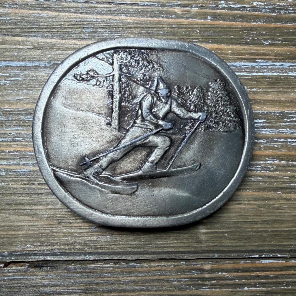 Vintage 1977 Indiana Metal Craft Alpine Skier Belt Buckle Silver Tone Oval 70s